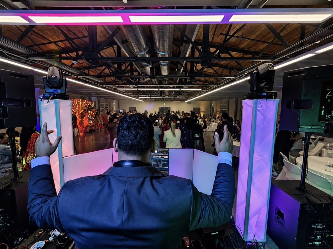 A Vyoma Productions DJ lifting the dance floor at an Indian wedding reception